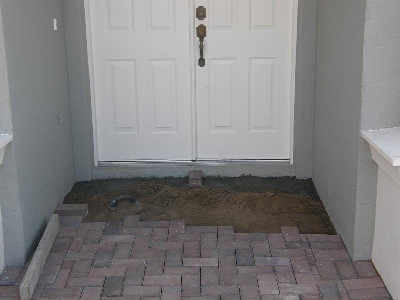 05Using Sand to Ensure Pavers are Secure.JPG